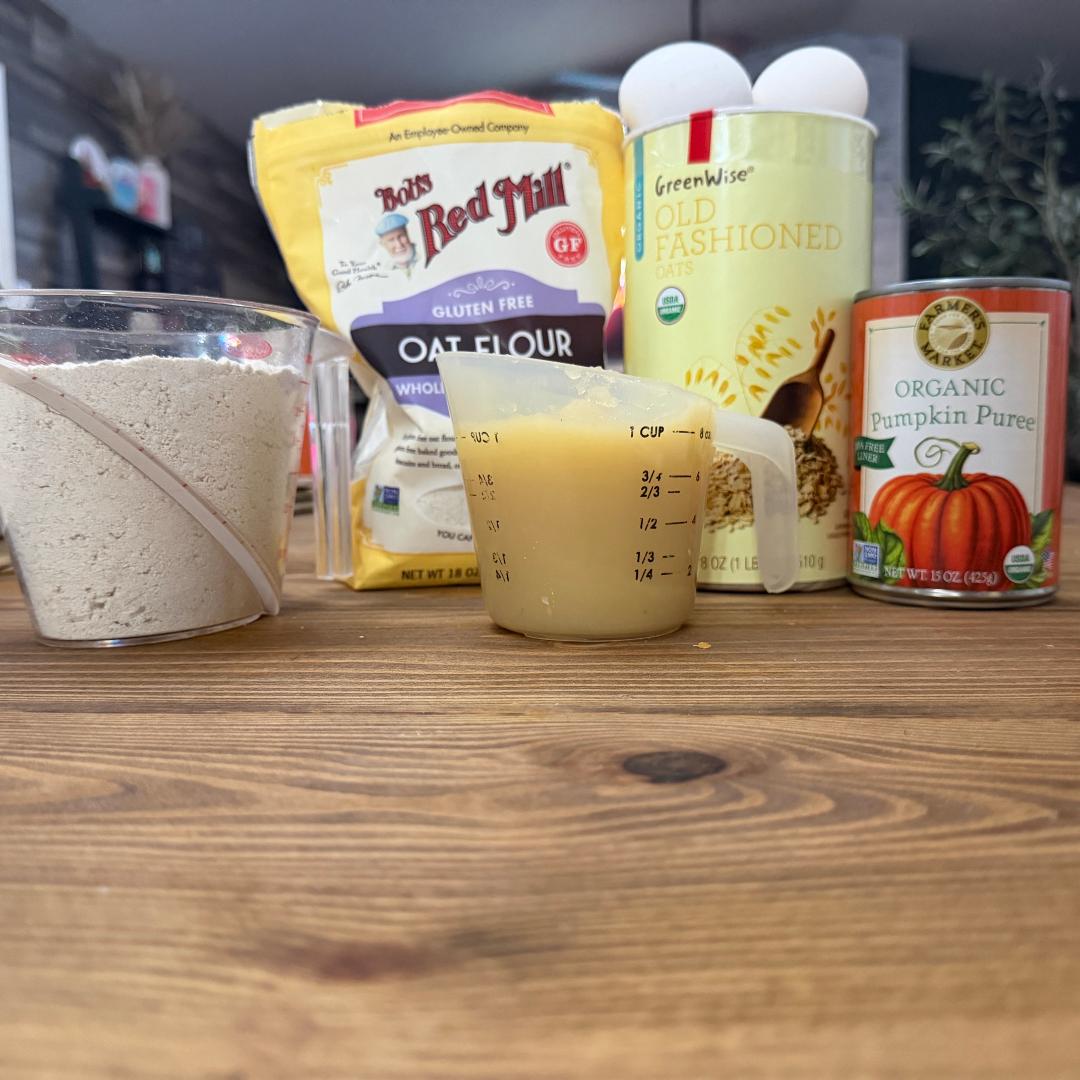 Real ingredients on the Bone Appétreat counter: gluten-free oat flour, old-fashioned oats, organic pumpkin purée, applesauce and eggs